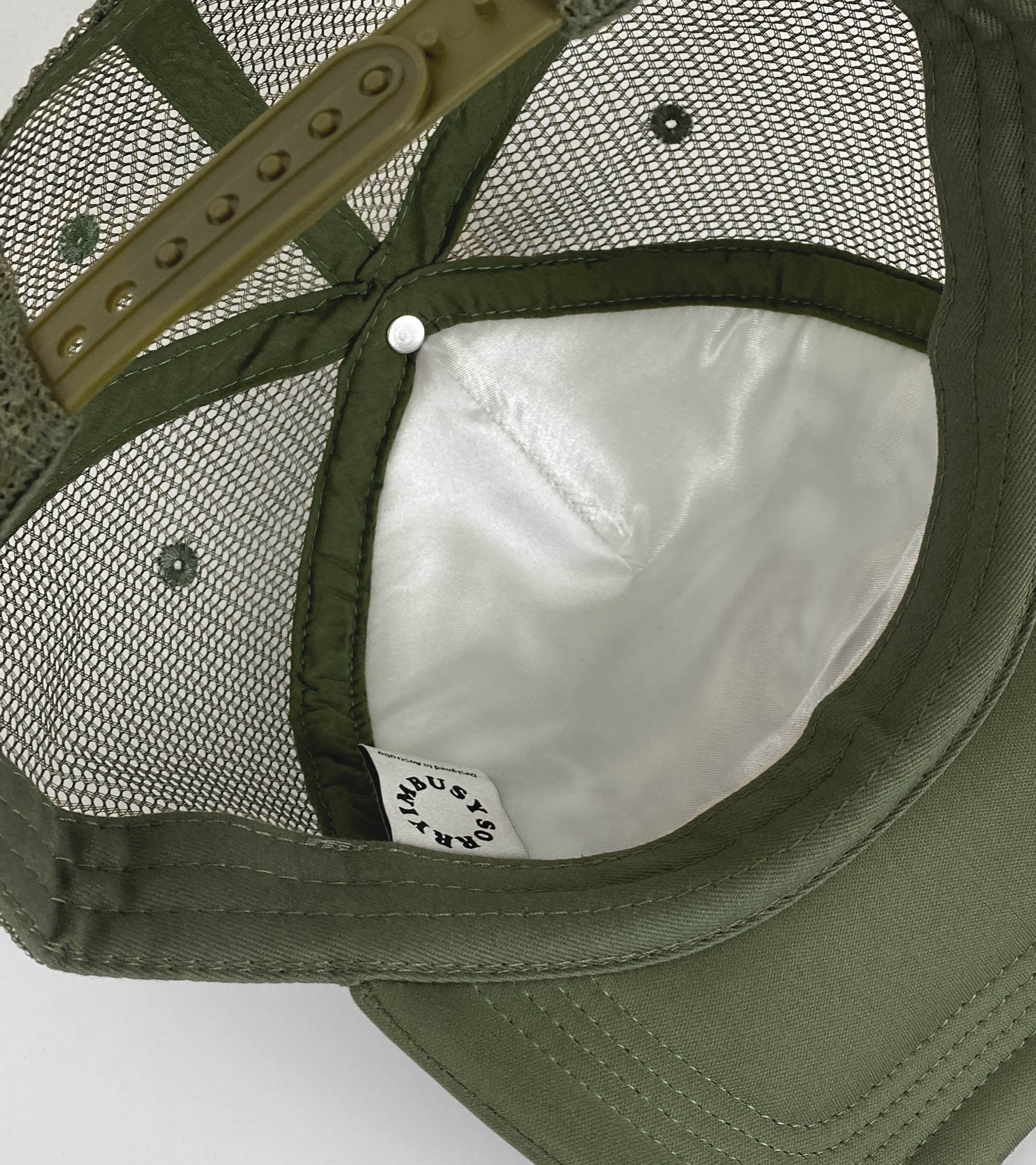 SORRYIMBUSY - DELUSIONAL OPTIMIST TRUCKER CAP - OLIVE